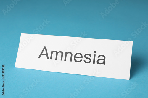 Card with word Amnesia on light blue background