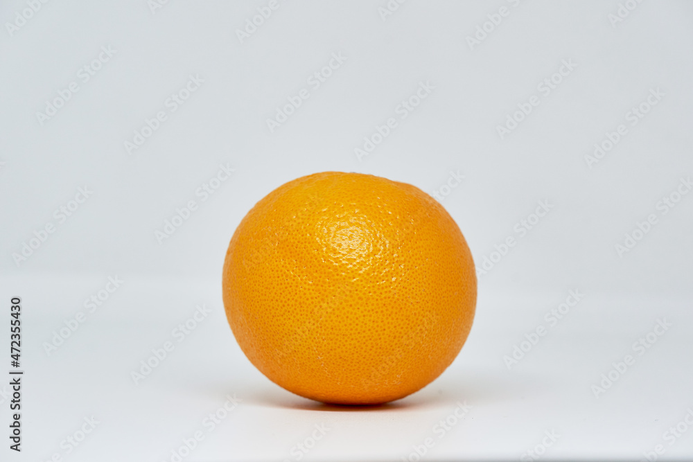 An orange on white background. One orange isolated on white background. An orange on white background. One orange isolated on white background.
