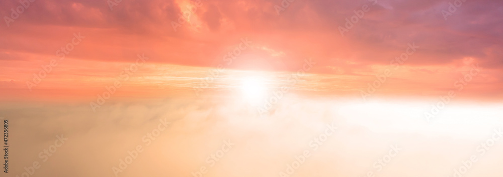 Fototapeta premium Beautiful sunrise above the clouds