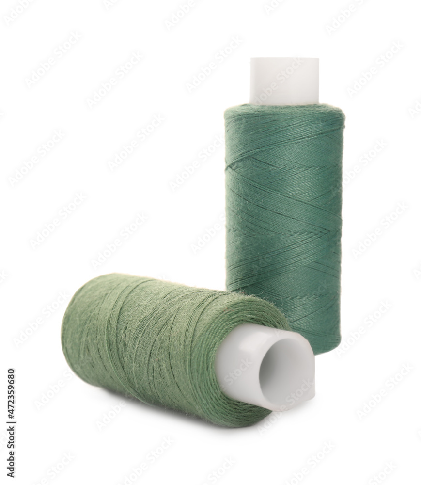 Different colorful sewing threads on white background Different colorful sewing threads on white background