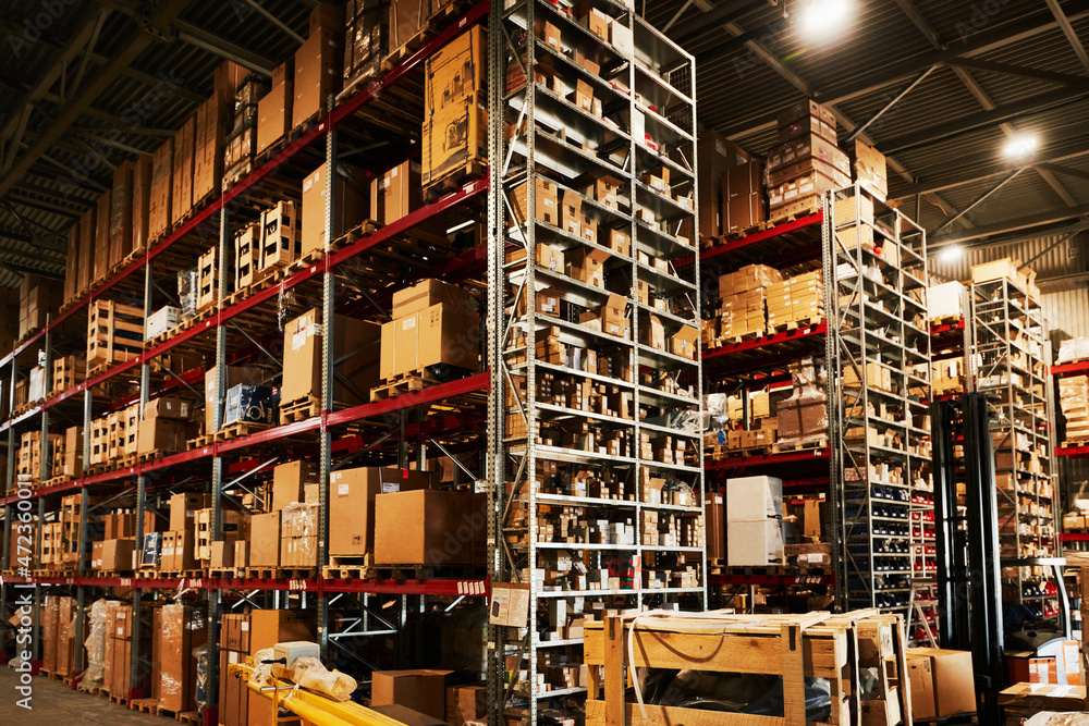 Finished goods warehouse. Logistics center. Goods on racks ready to be shipped to customers. Finished goods warehouse. Logistics center. Goods on racks ready to be shipped to customers.