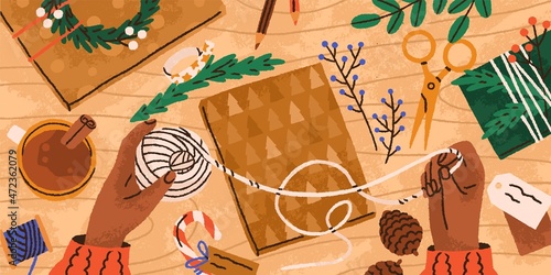 Hands preparing DIY Christmas gift with box in craft paper wrapping, thread, fir branches and eco decor on table. Making and decorating modern Xmas present, top view. Colored flat vector illustration