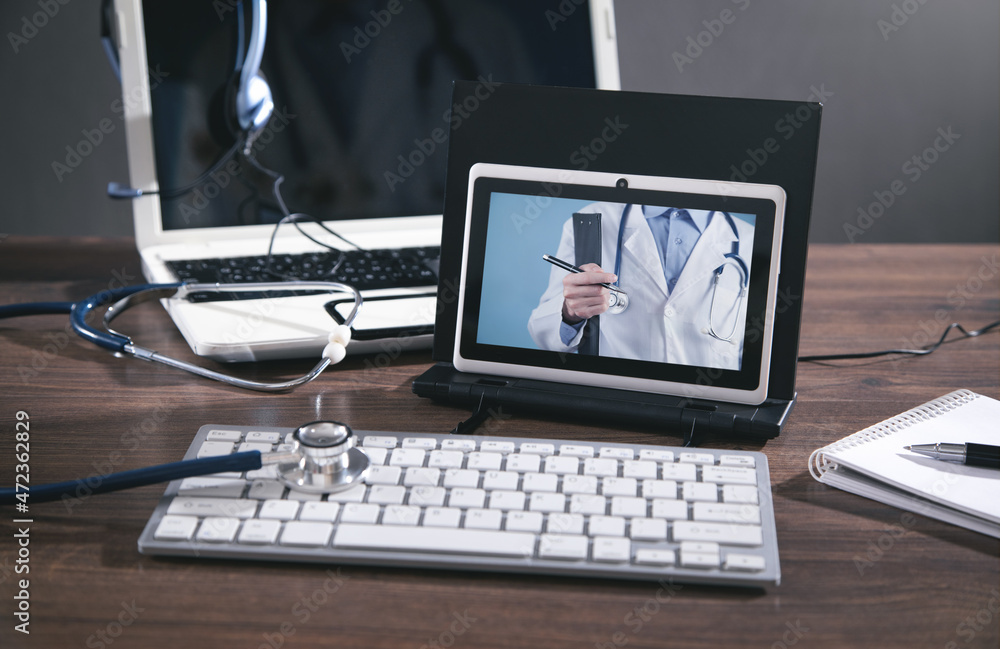Tablet, stethoscope, headset. Online doctor. Telemedicine concept Tablet, stethoscope, headset. Online doctor. Telemedicine concept