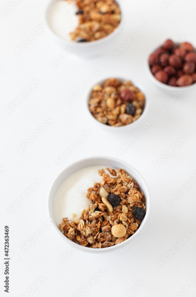 A healthy breakfast of cereals, nuts and raisins. Yogurt. A healthy breakfast of cereals, nuts and raisins. Yogurt.
