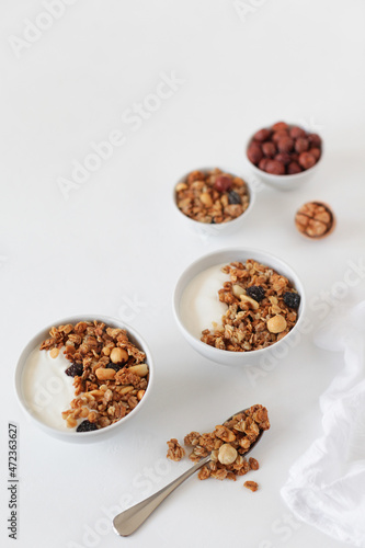 Homemade breakfast granola with nuts and raisins. Healthy food. Copy space.