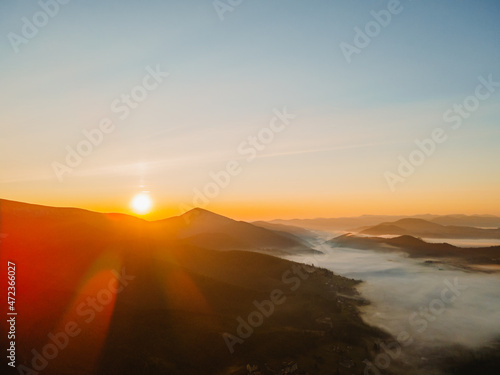 Wallpaper Mural aerial view of sunrise above mountain range Torontodigital.ca