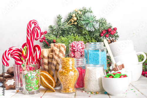 Christmas hot chocolate party bar, winter cocoa buffet with a lot of hot chocolate mugs, various topping, sprinkles, sweet appetizers