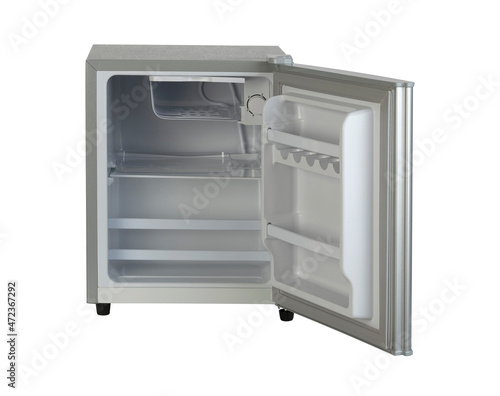 Small opened refrigerator with empty space isolated on white background