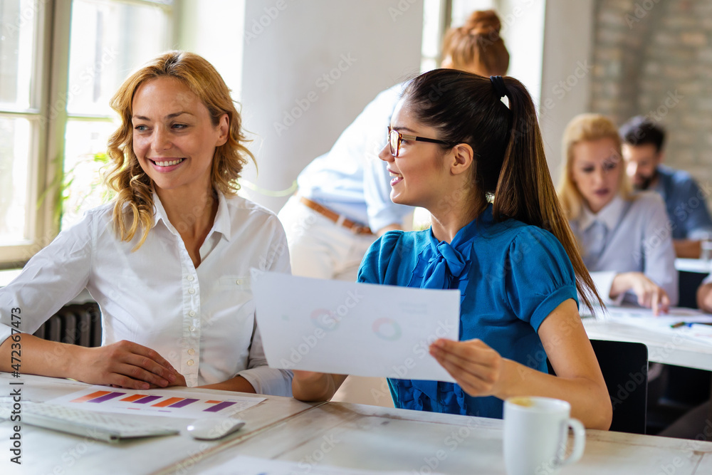 Group of multiethnic business people working at the office. Startup finance teamwork concept Group of multiethnic business people working at the office. Startup finance teamwork concept