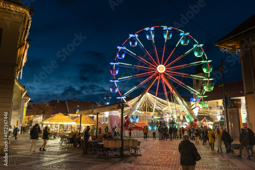 Colored Ferris Wheel at Christmas Market on a calm night