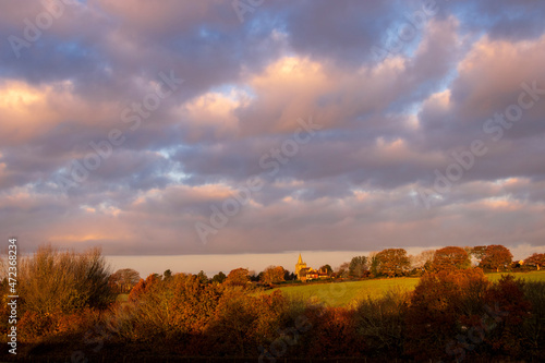 Dallington church on the high weald in east Sussex during a colourful autumn morning sunrise