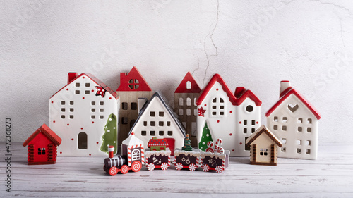 Santa's Christmas toy train in front of a fabulous village