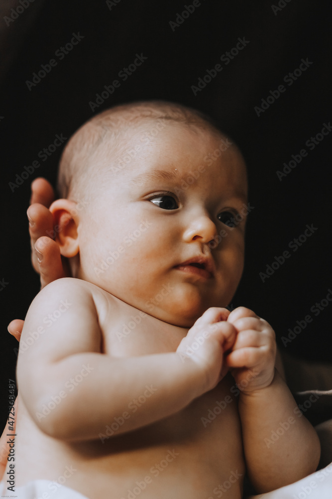 Candid shot of three month old infant baby during day nap time. Dry and healthy body and skin for children concept. Baby nursery Candid shot of three month old infant baby during day nap time. Dry and healthy body and skin for children concept. Baby nursery