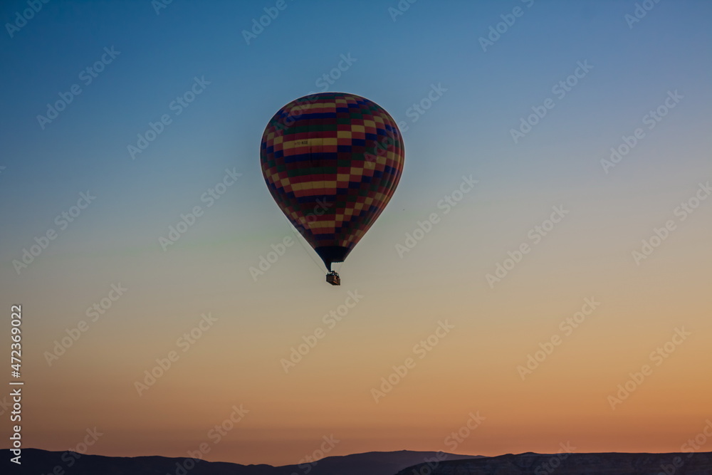 Hot air balloons flying over the valley at Cappadocia, Turkey. G Hot air balloons flying over the valley at Cappadocia, Turkey. G