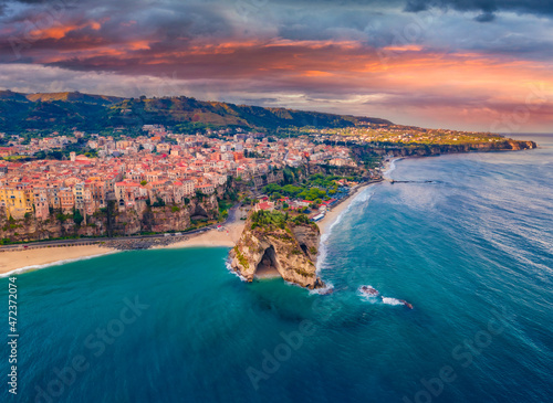 Gloomy morning cityscape of Tropea town before the rain, Italy, Europe. Dramatic summer scene of east coast of Calabria. Traveling concept background. photo
