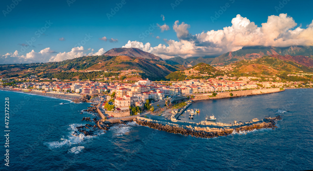 Breathtaking summer view from flying drone of Diamante port, Province of Cosenza. Colorful evening seascape of Mediterranena sea. Landscape of mountain coast of Italy. Traveling concept background.