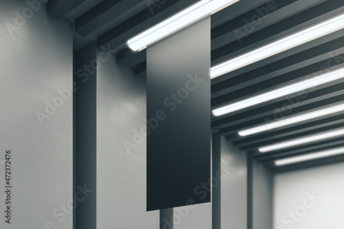 Clean empty black rectangular mock up poster on blurry concrete interior background. Exhibition and stopper concept. 3D Rendering.