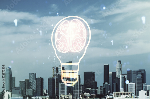 Abstract virtual idea concept with light bulb and human brain illustration on Los Angeles skyline background. Neural networks and machine learning concept. Multiexposure