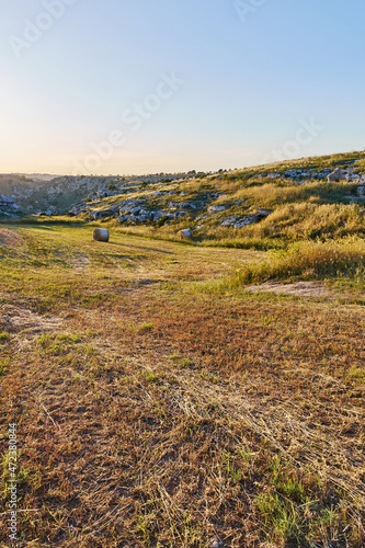 Summer landscape in Matera wheat fields, south Italy. Sunset in the sky.