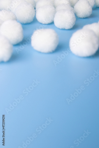 White Pom-Pom on Blue Background