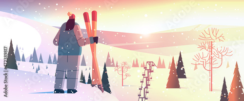skier woman standing with equipment sportswoman skiing doing activities winter vacation concept
