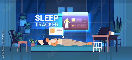 young woman sleeping in bed with electronic smart watch app tracker on hand quality and quantity sleep control