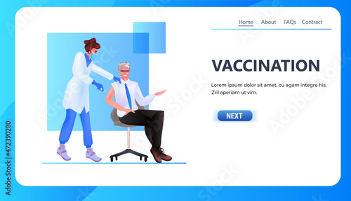 female doctor in mask vaccinating male patient fight against coronavirus vaccine development concept