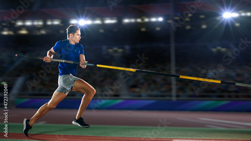 Tableau sur toile Pole Vault Jumping: Professional Male Athlete on World Championship Running with Pole to Jump over Bar