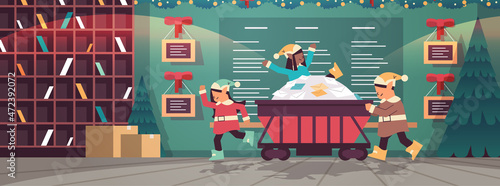 elves preparing for new year and christmas holidays celebration mix race santa helpers pushing mine cart