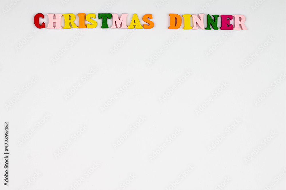 Christmas Dinner menu template on white background. Copy space for text. Christmas menu background concept. Design card for a restaurant menu for a Christmas evening. Colorful letters. Close-up