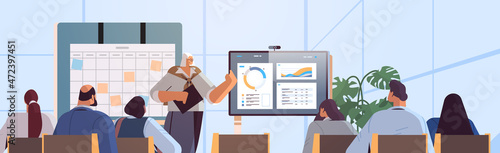 businesswoman presenting financial statistic diagram for businesspeople at conference meeting business presentation