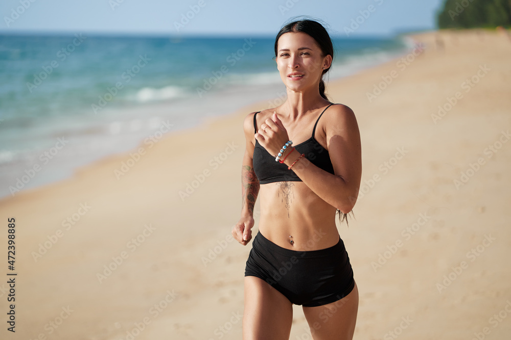 Healthy lifestyle. Jogging outdoors. Young woman exercising on sea beach. Healthy lifestyle. Jogging outdoors. Young woman exercising on sea beach.