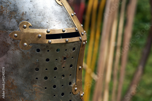 Obraz na płótnie Knight metal helmet closeup on spears background. Historical reenactment w salonie