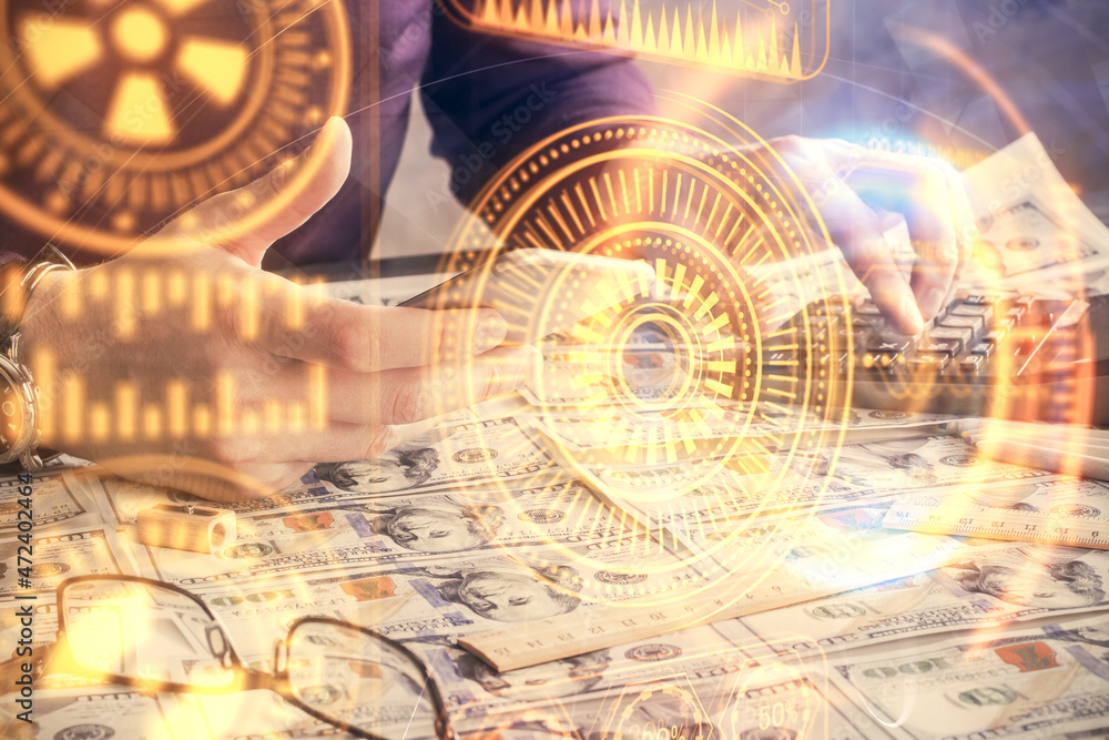 Double exposure of man's hands holding and using a digital device and tech theme hologram drawing. Technology concept. Double exposure of man's hands holding and using a digital device and tech theme hologram drawing. Technology concept.