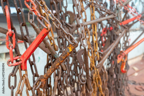 Safe cargo lashing onboard of ship deck with cargo lashing chains and tensioner. photo