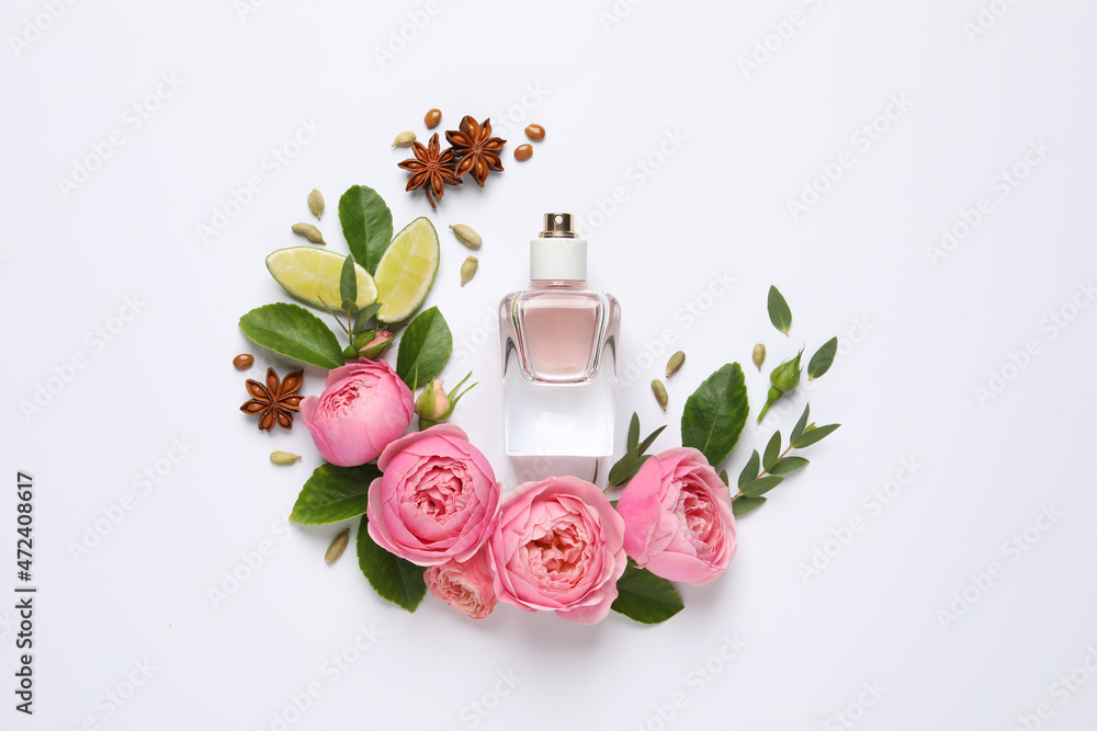 Flat lay composition with bottle of perfume, lime and beautiful flowers on white background - obrazy, fototapety, plakaty 