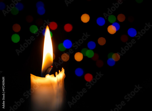 burning candle in the dark