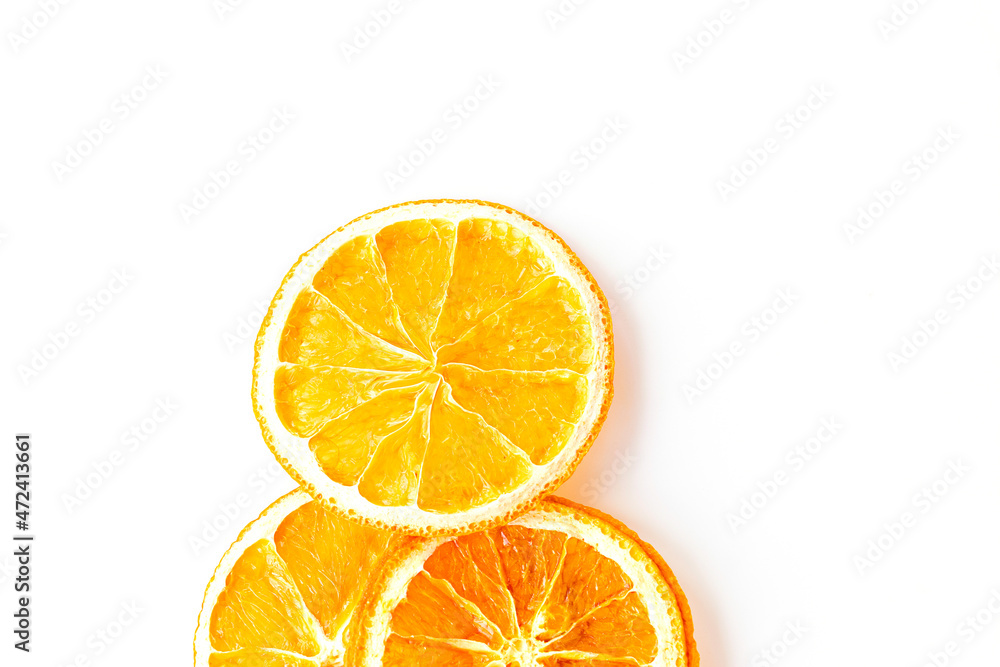 flat lay with ripe and dried round slices of orange isolated on white background. fruit chips. healthy sweets. soft focus flat lay with ripe and dried round slices of orange isolated on white background. fruit chips. healthy sweets. soft focus