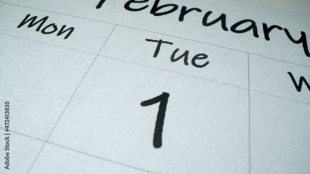 February 2022. First day of new month. Start tomorrow concept.. New year's calendar 2022 close up macro shot February 2022. First day of new month. Start tomorrow concept.. New year's calendar 2022 close up macro shot