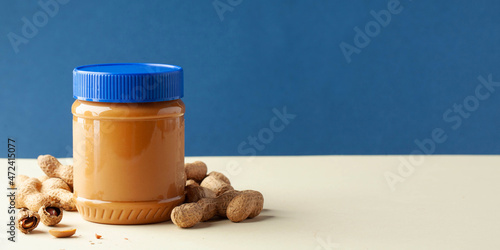 фотографія Closed can of peanut butter. Banner. Copy space.