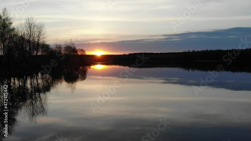 Wallpaper Mural Pink sunset over the lake. The drone slowly flies over the surface of the river filming the sunset. Torontodigital.ca