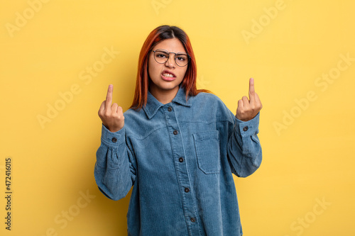 Quadro em tela young hispanic woman feeling provocative, aggressive and obscene, flipping the m