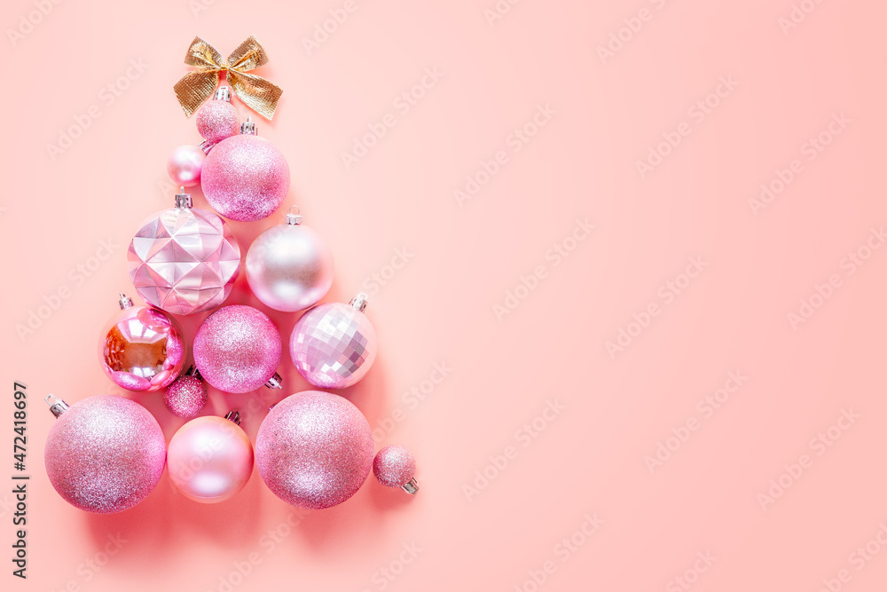 Christmas tree made of pink balls and golden bow on pink background, Christmas tree alternatives Christmas tree made of pink balls and golden bow on pink background, Christmas tree alternatives