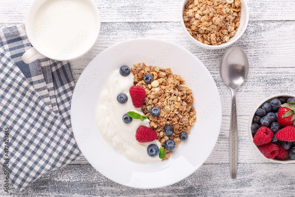 Healthy breakfast with baked granola and greek yogurt. Assorted fresh berries Healthy breakfast with baked granola and greek yogurt. Assorted fresh berries