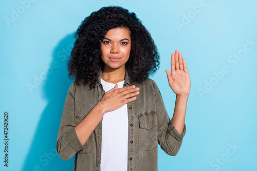 Photography Photo of young african woman arm on chest sincere solemn promise tell the truth