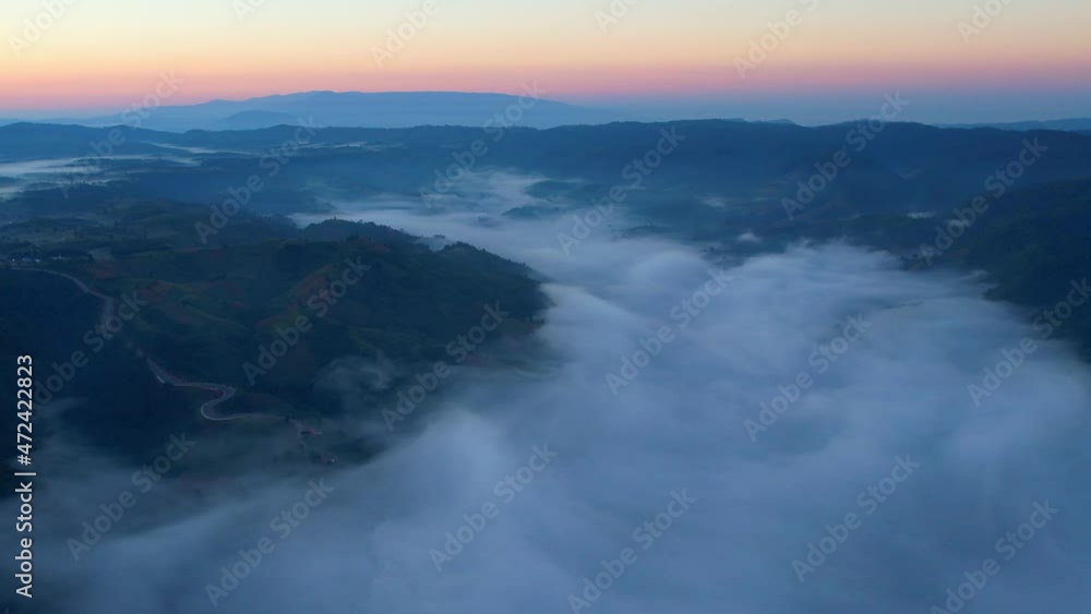 4K Drone Flying through the clouds at dusk or dawn. Aerial top cloudscape view from drone. Tropical forest with smoke and fog.
4K Drone Flying through the clouds at dusk or dawn. Aerial top cloudscape view from drone. Tropical forest with smoke and fog.