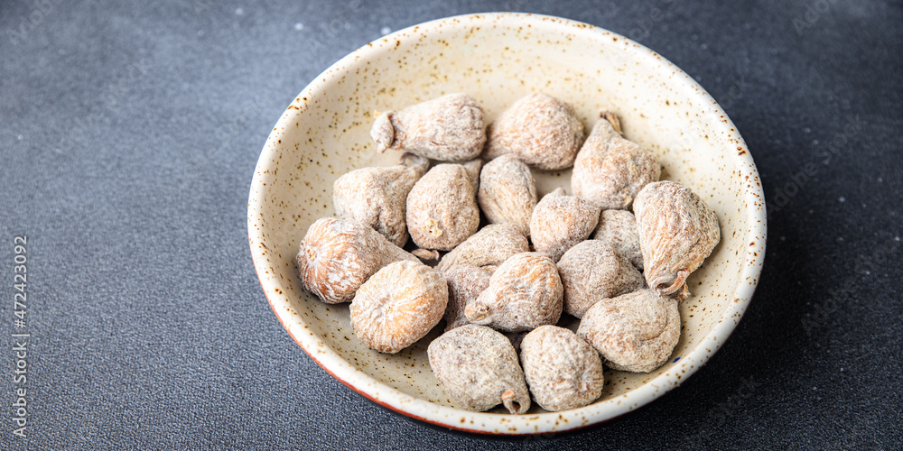 dried figs natural sweets dried fruits meal snack on the table copy space food background rustic. top view keto or paleo diet veggie vegan or vegetarian food dried figs natural sweets dried fruits meal snack on the table copy space food background rustic. top view keto or paleo diet veggie vegan or vegetarian food
