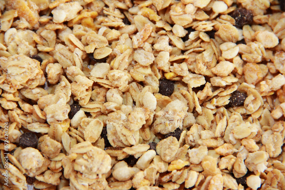 dry sweet granola with chocolate pieces dry sweet granola with chocolate pieces