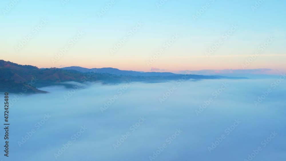 4K Drone Flying through the clouds at dusk or dawn. Aerial top cloudscape view from drone. Tropical forest with smoke and fog.
4K Drone Flying through the clouds at dusk or dawn. Aerial top cloudscape view from drone. Tropical forest with smoke and fog.