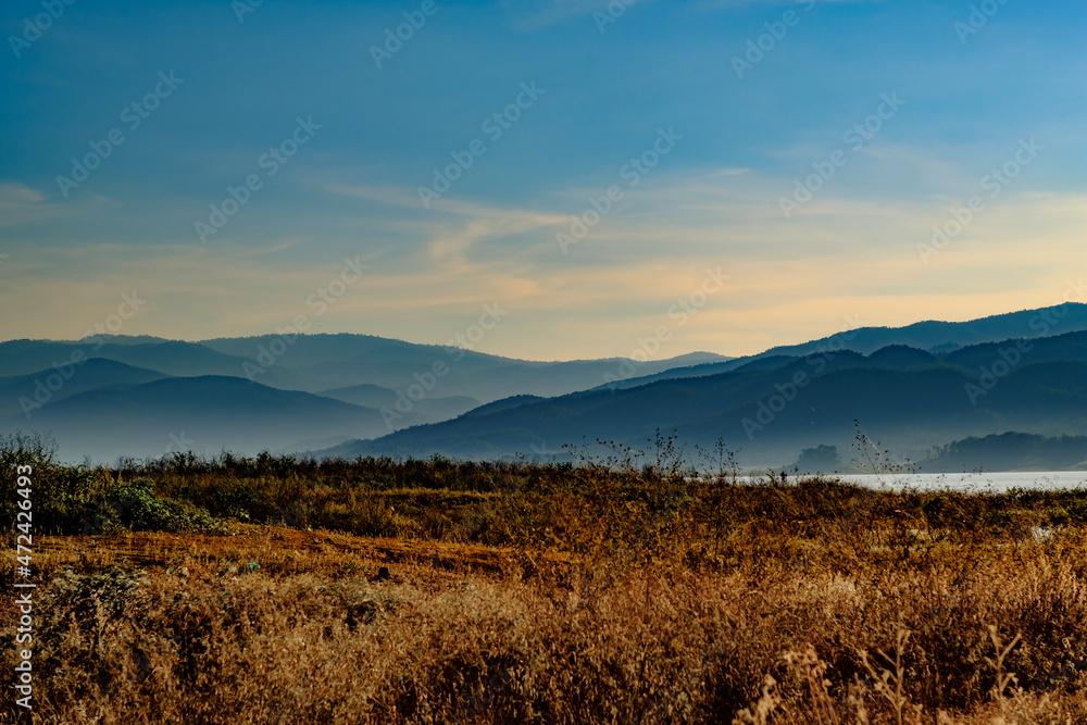 landscape of mountains, sky and lake
